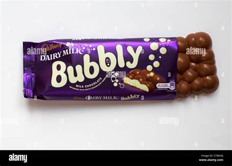 Bar of Cadbury Dairy Milk Bubbly chocolate bar with wrapper undone to show contents isolated on ...