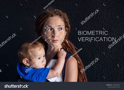 Biometric verification. Modern young woman with a baby. The concept of ...