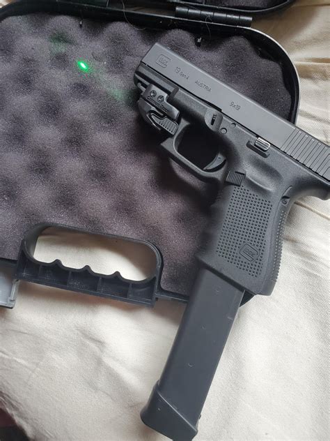 My Glock 19 Gen 4 w/ Crimson Trace green laser & 33 round extended ...