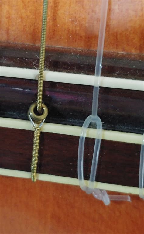 Installing Ball-End Nylon Strings on a Classical Guitar - Music ...