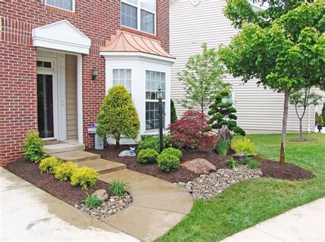 a house with landscaping in front of it