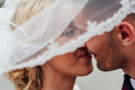 Groom and Bride Kissing · Free Stock Photo