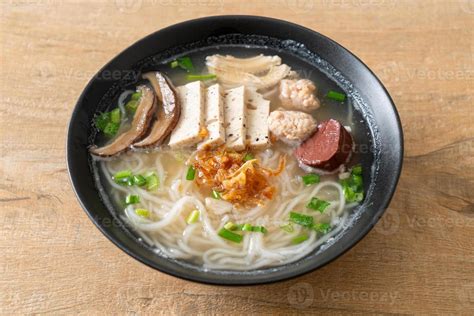 Vietnamese Rice Noodles Soup with Vietnamese Sausage served vegetables and crispy onion 12852324 ...