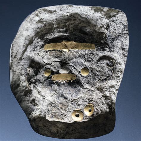 Clay mask of a human face with gold jewelry from Grave 2, … | Flickr