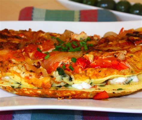 » Duck egg omelette with onions, tomatoes, goat cheese and herbs