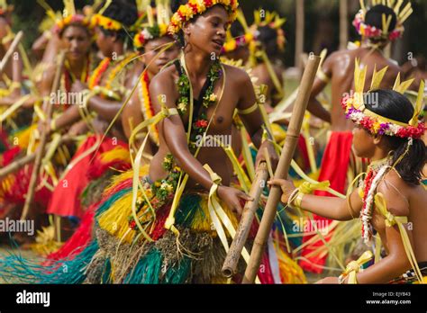 Yapese girls in traditional clothing dancing with bamboo pole at Yap ...