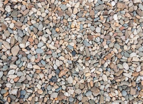 rocks and gravel are arranged together on the ground to create a ...