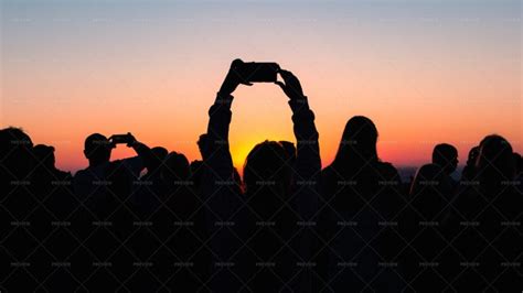 Silhouette Of People Photographing Dawn - Stock Photos | Motion Array