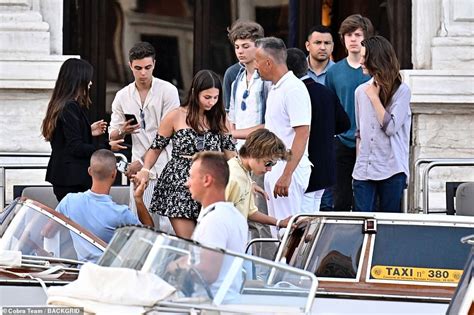 Elon Musk is spotted out and about in Venice and kids climb on board a boat a day after meeting ...