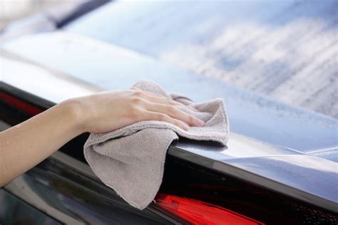 Premium Photo | Women hand dry wiping car surface with microfiber cloth after washing.