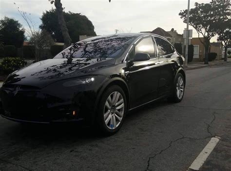 Black Tesla Model X prototype spotted in the wild with a trailer hitch and redesigned front end ...