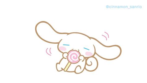 a cartoon character holding a lollipop in its mouth with the caption cinnamon, sanrio