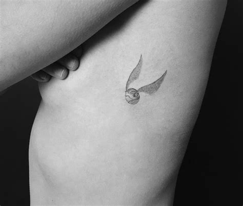 Golden Snitch by Jakub Nowicz | Snitch tattoo, Harry tattoos, Golden snitch tattoo