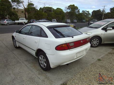 Mazda 323 Astina 1997 5D Hatchback Automatic 1 8L Multi Point F INJ Seats in VIC