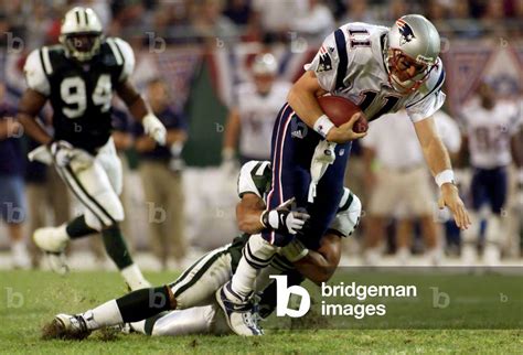 Image of PATRIOTS QUARTERBACK DREW BLEDSOE TACKLED BY JETS LINEBACKER FARRIOR, 2000-09-11