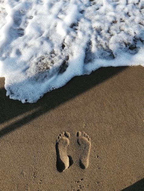 Footprints on Beach Sand · Free Stock Photo