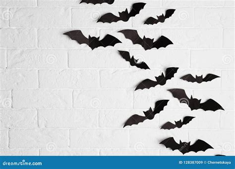 Paper Bats on Brick Wall with Space for Text Stock Image - Image of ...