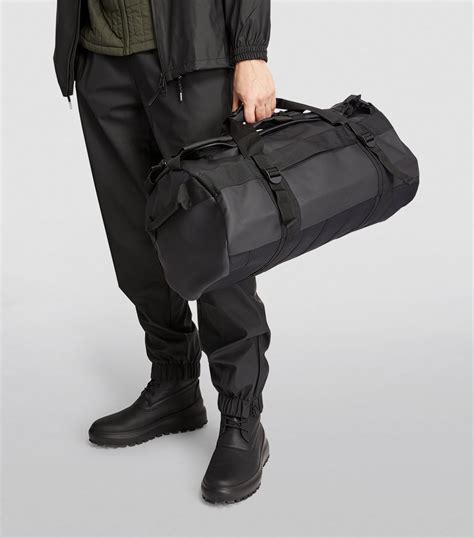 Mens Rains black Waterproof Duffel Bag | Harrods # {CountryCode}