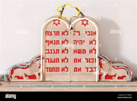 Small model of the Ten Commandments stone tablets from the Hebrew Bible written in Hebrew in red ...