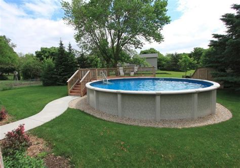 Above ground pool with partial deck and sidewalk. … | Backyard pool ...