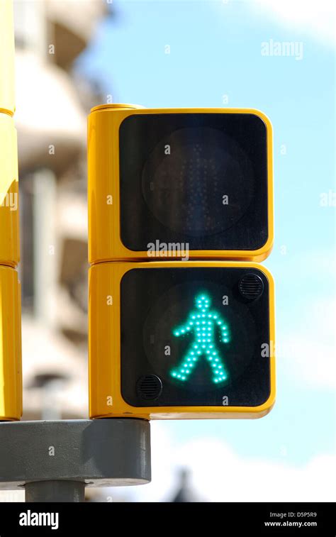 Pedestrian signal light showing green walking man in city centre of ...