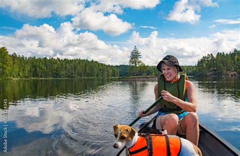 Woman canoeing on the lake Stock Photo | Adobe Stock