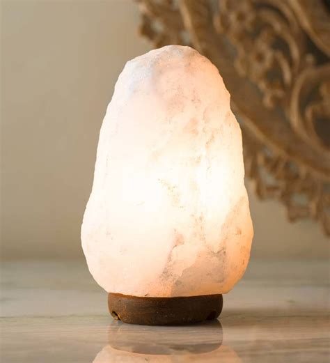 Reminiscent of a natural quartz crystal when lit, this hand-carved ...