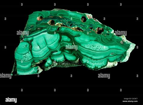 Cut green malachite (Cu2CO3(OH)2 Stock Photo - Alamy