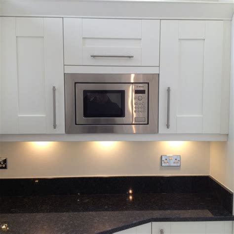 Built in Bosch microwave with lift up cupboard above. Great space management solution for your # ...