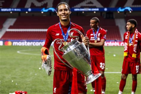 Virgil Van Dijk Holding Champions League Trophy