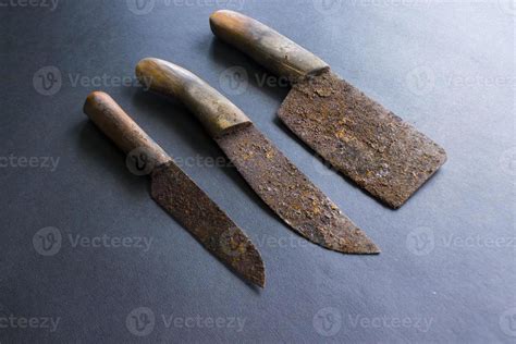 Rusty meat knife isolated on stone backgroundRusty meat knife isolated ...