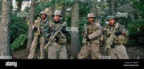 (L to R) Michael Murphy (TAYLOR KITSCH), Marcus Luttrell (MARK WAHLBERG), Matt "Axe" Axelson ...