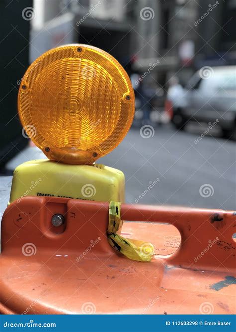 Orange Construction Warning Light on the Street Stock Photo - Image of ...