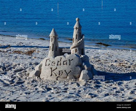 Freshly built and fancy sand castle with the name of the town. Beach at Cedar Key, Florida, USA ...