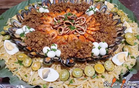 Pancit Malabon Recipe with eggs, squid and shrimp