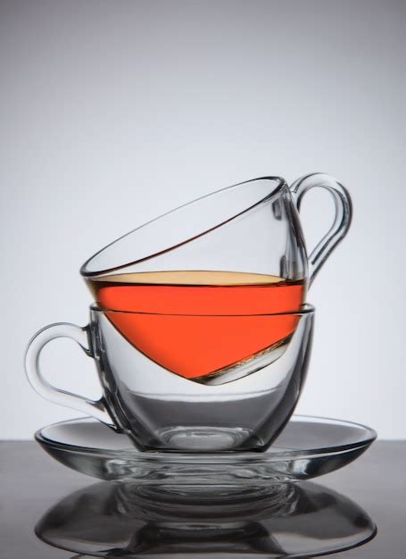 Premium Photo | Glass cups of tea on saucer, good concept the idea