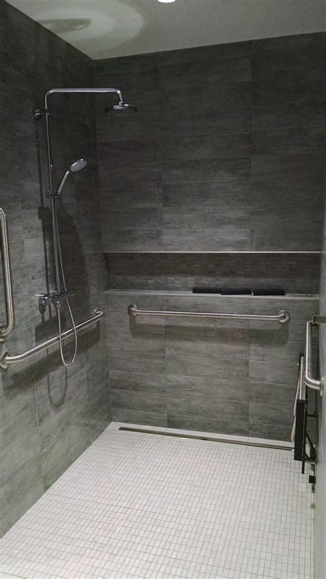 ADA Roll in shower. Grohe valve & tile covered linear drain. Converted ...