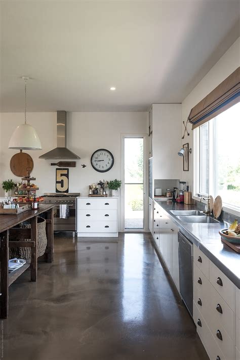 "Styled Kitchen With Polished Concrete Flooring" by Stocksy Contributor ...