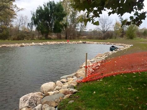 Rock border around pond | Garden bridge, Rock border, Outdoor structures