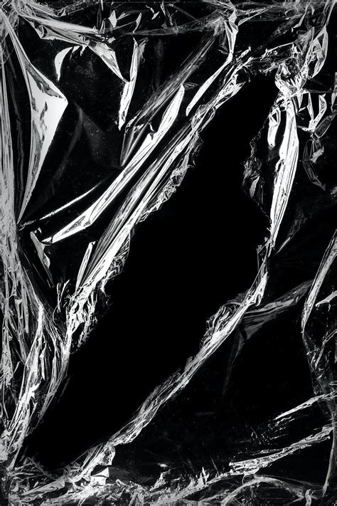 Wrinkled plastic wrap texture design element on a black background | premium image by rawpixel ...