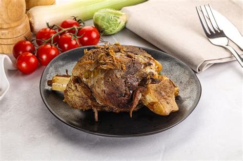 Premium Photo | Baked lamb shank with bone marinated in spices