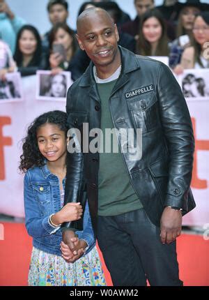 Actor Dave Chappelle and his daughter Sonal arrive on the red carpet for the film "A Star is ...