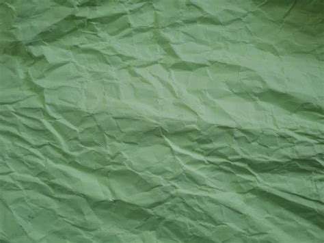 Premium Photo | Crumpled green paper background | Paper texture green, Green texture background ...