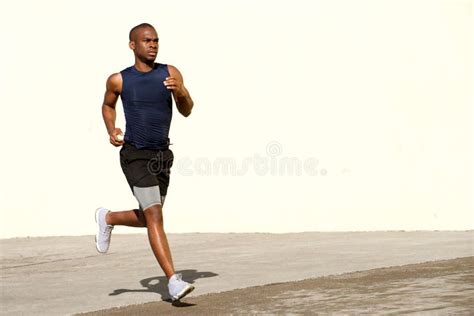 Healthy Young Black Man Running Outside on Street Stock Image - Image ...