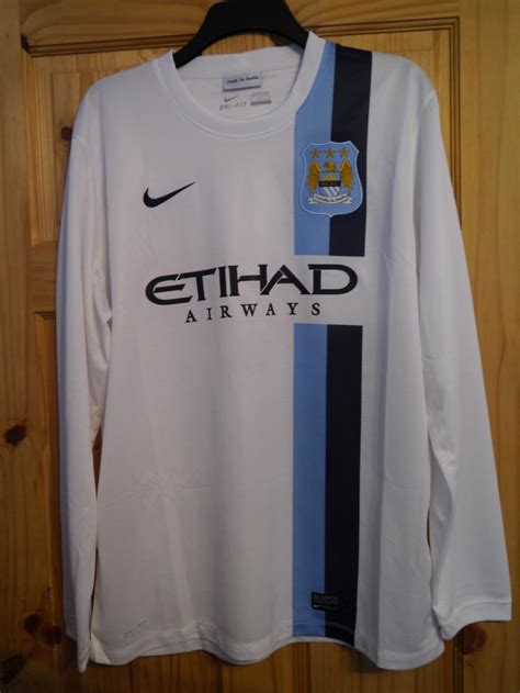 Manchester City Third football shirt 2013 - 2014. Sponsored by Etihad