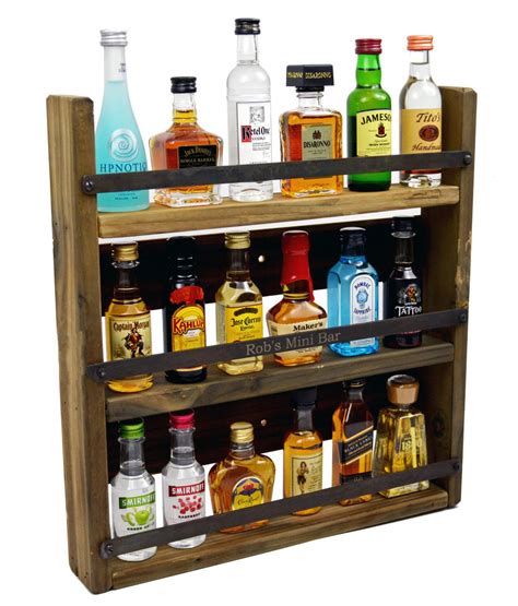 We found a mini-bar that holds our favorite miniature liquor bottles! Description from etsy.com ...