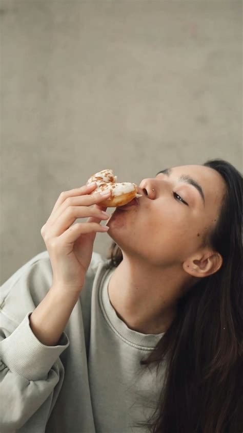 Young Woman Eating Cake From A Box · Free Stock Video