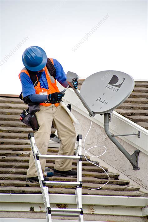 Satellite dish installation - Stock Image C012/3085 - Science Photo Library