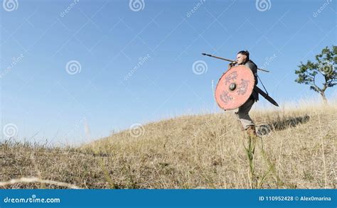 A Viking Warrior Throws a Spear during an Attack. Stock Photo - Image ...