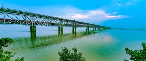 Train and Bus Passes through Road Railway Bridge Over the Godavari River at Sunset, Rajahmundry ...